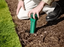 Technician Installing the Sentricon® Termite Colony Elimination System